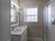 Bathroom with double vanity and walk-in shower at 5154 Central Dr, Stone Mountain, GA 30083