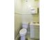 Small bathroom with toilet, sink, and vanity at 5154 Central Dr, Stone Mountain, GA 30083