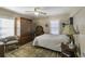 Bedroom with wooden armoire and patterned carpet at 5154 Central Dr, Stone Mountain, GA 30083