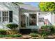 Inviting front porch with glass door, and welcoming decor at 5154 Central Dr, Stone Mountain, GA 30083