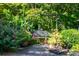 Peaceful garden with swing and flowering plants at 5154 Central Dr, Stone Mountain, GA 30083