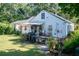 White house with landscaped yard and patio at 5154 Central Dr, Stone Mountain, GA 30083