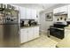 Bright kitchen with stainless steel appliances and white cabinets at 5154 Central Dr, Stone Mountain, GA 30083