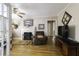 Spacious living room with hardwood floors, fireplace, and comfortable seating at 5154 Central Dr, Stone Mountain, GA 30083