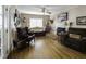Bright living room with hardwood floors, fireplace, and ample natural light at 5154 Central Dr, Stone Mountain, GA 30083