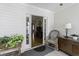 Cozy screened porch features wicker chair and view into living room at 5154 Central Dr, Stone Mountain, GA 30083