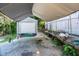 Gray storage shed with roll-up door under a canopy at 5154 Central Dr, Stone Mountain, GA 30083