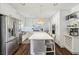 White kitchen with stainless steel appliances and a built-in wine rack at 7310 Hunters Branch Dr, Atlanta, GA 30328