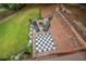 Landscaped backyard with firepit and giant chessboard at 131 Gold Springs Ct, Canton, GA 30114