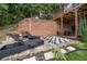 Landscaped backyard with chessboard, fire pit and patio at 131 Gold Springs Ct, Canton, GA 30114