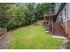 Spacious backyard with deck, stairs, and lush lawn at 131 Gold Springs Ct, Canton, GA 30114