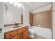 Basement bathroom with tub and wood vanity at 131 Gold Springs Ct, Canton, GA 30114