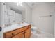 Clean bathroom with wood vanity and tiled floors at 131 Gold Springs Ct, Canton, GA 30114