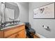 Modern powder room with black fixtures and granite vanity at 131 Gold Springs Ct, Canton, GA 30114