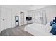 Bright bedroom with TV, ceiling fan, and window at 131 Gold Springs Ct, Canton, GA 30114