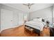 Spacious bedroom with hardwood floors and ceiling fan at 131 Gold Springs Ct, Canton, GA 30114