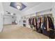 Bright walk-in closet with custom shelving and hanging rods at 131 Gold Springs Ct, Canton, GA 30114