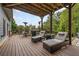 Covered deck with lounge chairs and heaters, great for all seasons at 131 Gold Springs Ct, Canton, GA 30114
