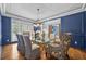 Formal dining room with hardwood floors, blue walls, and chandelier at 131 Gold Springs Ct, Canton, GA 30114
