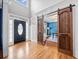 Bright two story foyer with hardwood floors and barn doors at 131 Gold Springs Ct, Canton, GA 30114