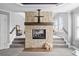 Stone fireplace with a wood mantle and built in TV mount at 131 Gold Springs Ct, Canton, GA 30114
