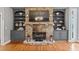 Elegant stone fireplace with built-in shelving on either side at 131 Gold Springs Ct, Canton, GA 30114