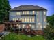 Two-story home with deck and backyard at dusk at 131 Gold Springs Ct, Canton, GA 30114