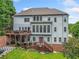 Two-story house with deck, landscaping, and patio at 131 Gold Springs Ct, Canton, GA 30114