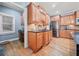 Kitchen features hardwood floors, stainless steel appliances, and ample cabinetry at 131 Gold Springs Ct, Canton, GA 30114