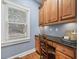Built-in work station with granite countertop and wood cabinetry at 131 Gold Springs Ct, Canton, GA 30114