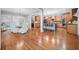 Open kitchen with light wood cabinets, an island, and hardwood floors at 131 Gold Springs Ct, Canton, GA 30114