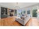 Bright living room featuring a stone fireplace and built-in shelving at 131 Gold Springs Ct, Canton, GA 30114