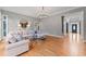 Spacious living room with hardwood floors, large windows and sectional sofa at 131 Gold Springs Ct, Canton, GA 30114