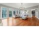 Spacious living room with hardwood floors, large windows, and comfortable seating at 131 Gold Springs Ct, Canton, GA 30114