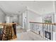 Elegant upstairs hall with hardwood floors and wrought iron railing at 131 Gold Springs Ct, Canton, GA 30114