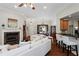 Living room features hardwood floors, fireplace and kitchen bar at 2142 Arbor Oaks, Marietta, GA 30062