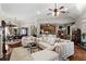 L-shaped sectional sofa in spacious living room with hardwood floors and kitchen views at 2142 Arbor Oaks, Marietta, GA 30062