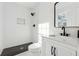 Bathroom featuring a shower, mirror, white vanity, and toilet at 3302 Mixon Way, Stone Mountain, GA 30087