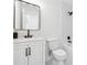 Bathroom featuring a shower, mirror, white vanity, and toilet at 3302 Mixon Way, Stone Mountain, GA 30087