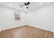 Unfurnished bedroom featuring wood floors, a ceiling fan, and natural light at 3302 Mixon Way, Stone Mountain, GA 30087