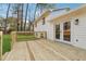 Spacious wooden deck with white railings and double doors leading to the home's interior at 3302 Mixon Way, Stone Mountain, GA 30087