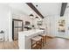 Modern kitchen with white cabinets, island, and stainless steel appliances at 3302 Mixon Way, Stone Mountain, GA 30087