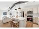 Open concept kitchen with island, stainless steel appliances, and modern lighting at 3302 Mixon Way, Stone Mountain, GA 30087