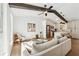 Spacious living area with vaulted ceiling, exposed beams, and modern decor at 3302 Mixon Way, Stone Mountain, GA 30087