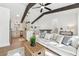 Open concept living room with kitchen and island, hardwood floors, and modern lighting at 3302 Mixon Way, Stone Mountain, GA 30087