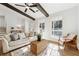Comfortable living room featuring a large sectional sofa and natural light at 3302 Mixon Way, Stone Mountain, GA 30087