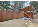 Backyard deck featuring an in-ground hot tub and privacy fence at 3930 Peachtree Dunwoody Ne Rd, Atlanta, GA 30342