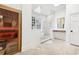 Bright bathroom featuring a large sauna, walk-in shower and a large vanity mirror at 3930 Peachtree Dunwoody Ne Rd, Atlanta, GA 30342