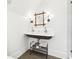 Bathroom with a double sink, a bamboo mirror and modern lighting at 3930 Peachtree Dunwoody Ne Rd, Atlanta, GA 30342