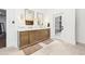 Elegant bathroom features dual sinks, vanity with a marble countertop and an exterior door at 3930 Peachtree Dunwoody Ne Rd, Atlanta, GA 30342